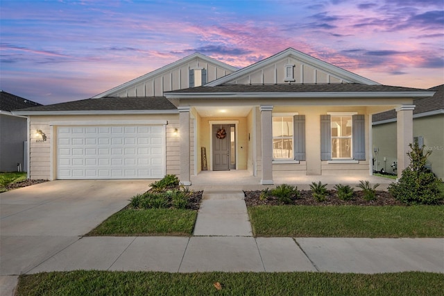 view of front of home with a garage and covered porch