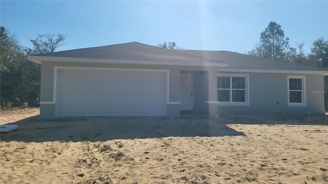 ranch-style house featuring a garage