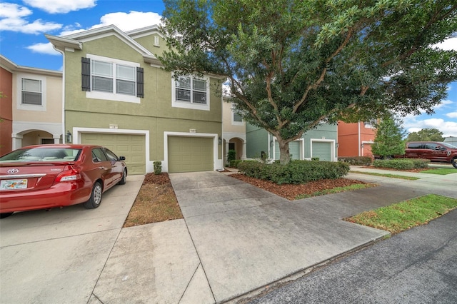 multi unit property featuring a garage