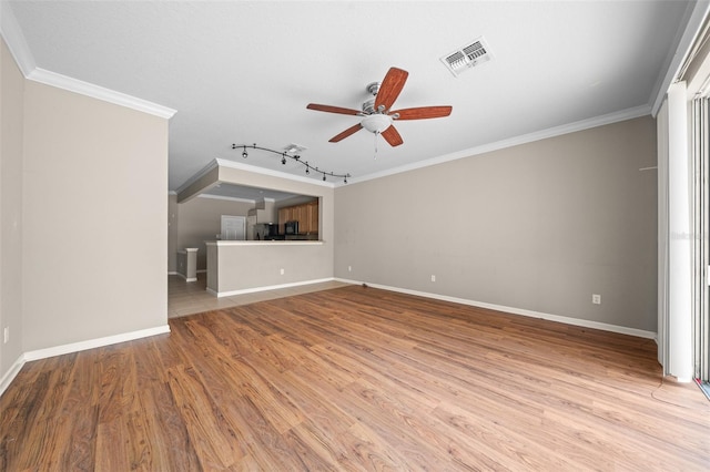 unfurnished living room featuring rail lighting, ceiling fan, light hardwood / wood-style floors, and crown molding