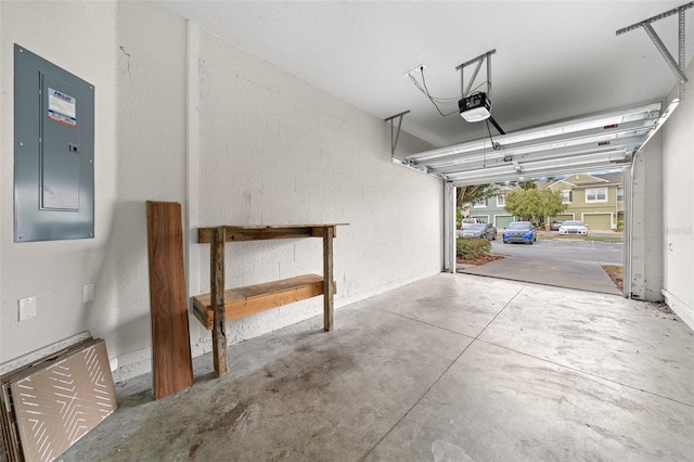 garage featuring a garage door opener and electric panel