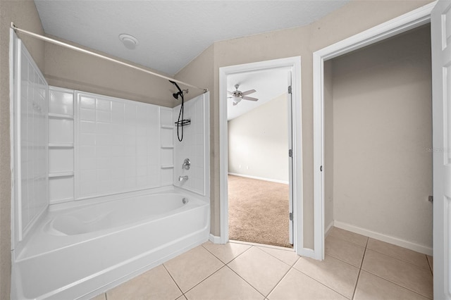 bathroom featuring a textured ceiling, tile patterned floors, shower / washtub combination, and ceiling fan