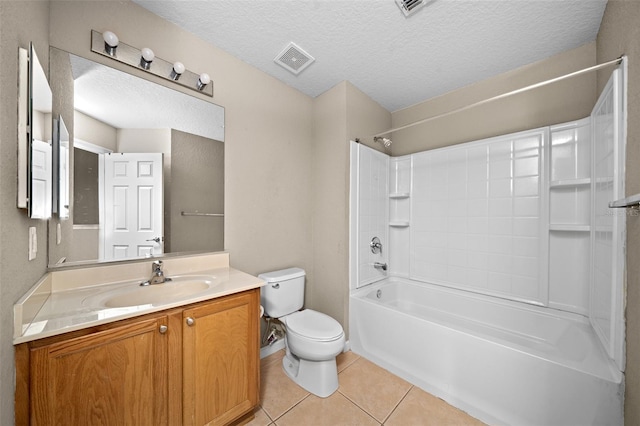 full bathroom featuring vanity, tile patterned floors, shower / washtub combination, toilet, and a textured ceiling