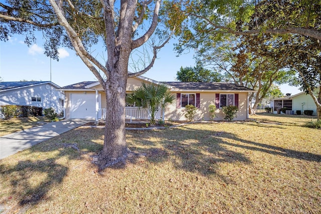 single story home featuring a garage and a front yard