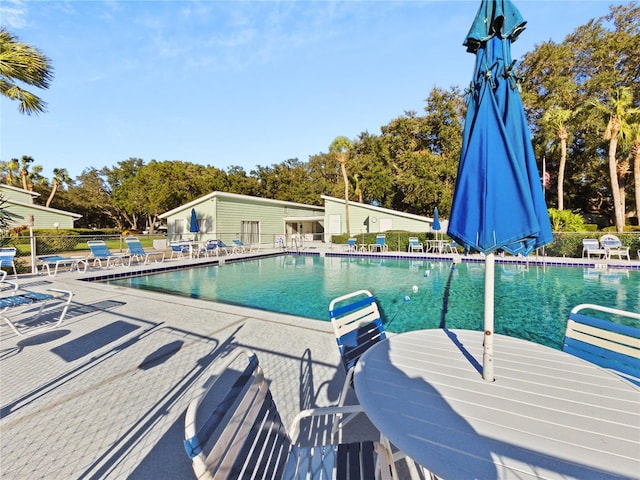 view of swimming pool featuring a patio