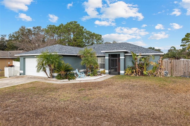 single story home with a front yard and a garage