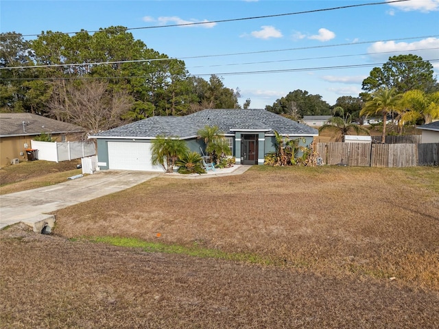 ranch-style house with a front yard and a garage