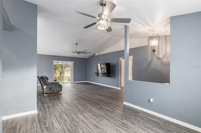 unfurnished living room with lofted ceiling, dark wood-type flooring, and ceiling fan with notable chandelier