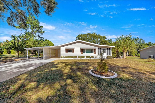 single story home with a front lawn and a carport