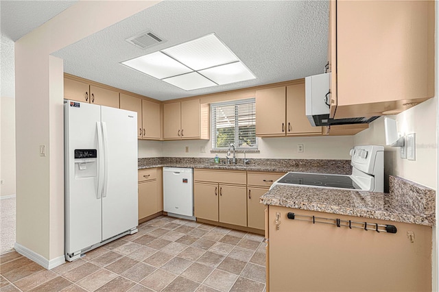 kitchen featuring a textured ceiling, sink, and white appliances