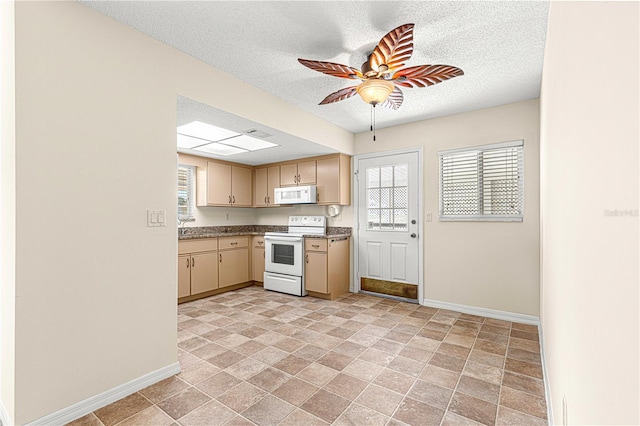 kitchen featuring ceiling fan, white appliances, a textured ceiling, and light brown cabinetry