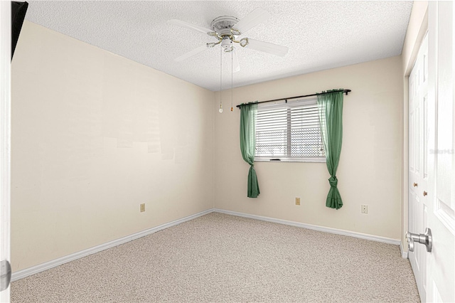 unfurnished room featuring a textured ceiling, light colored carpet, and ceiling fan