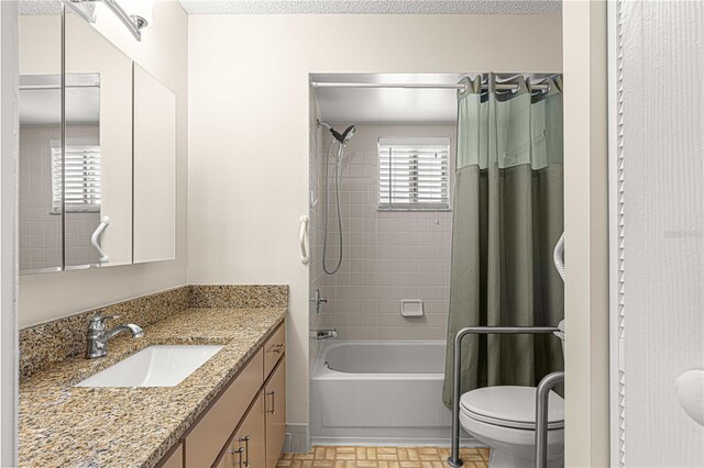 full bathroom with vanity, toilet, and shower / bathtub combination with curtain