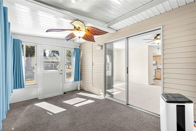 unfurnished sunroom featuring ceiling fan and lofted ceiling