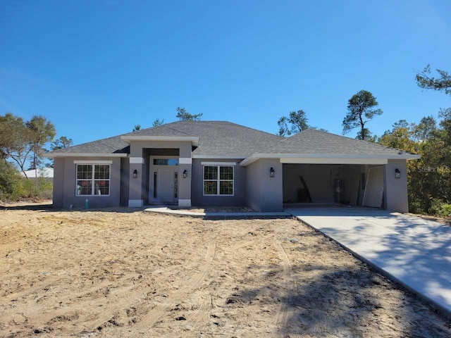 view of front of property featuring a garage