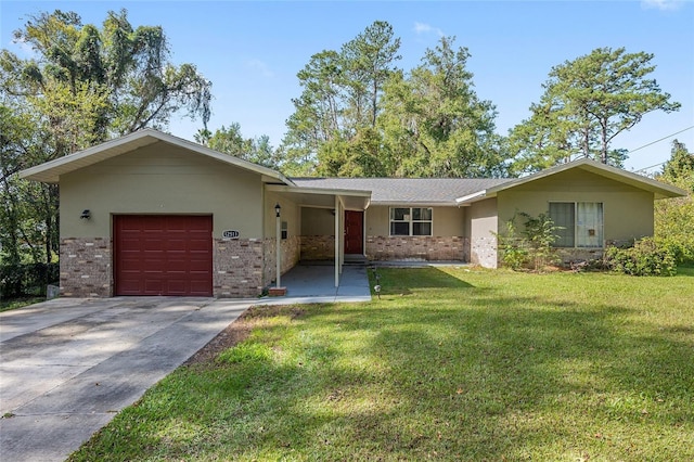 ranch-style house featuring a garage and a front yard