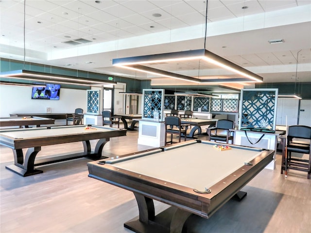 recreation room featuring visible vents, wood finished floors, and pool table