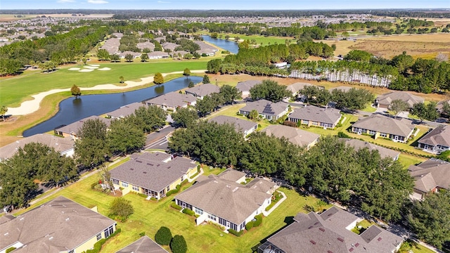 birds eye view of property with a residential view, a water view, and golf course view