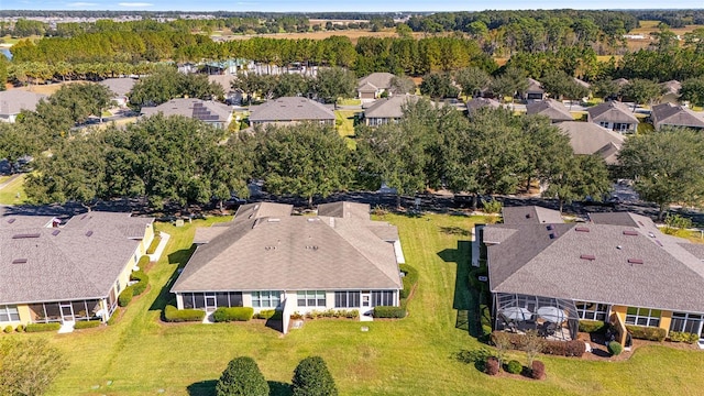 birds eye view of property with a residential view