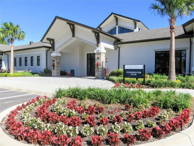 exterior space with driveway and stucco siding