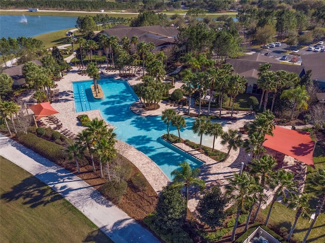 view of swimming pool featuring a water view