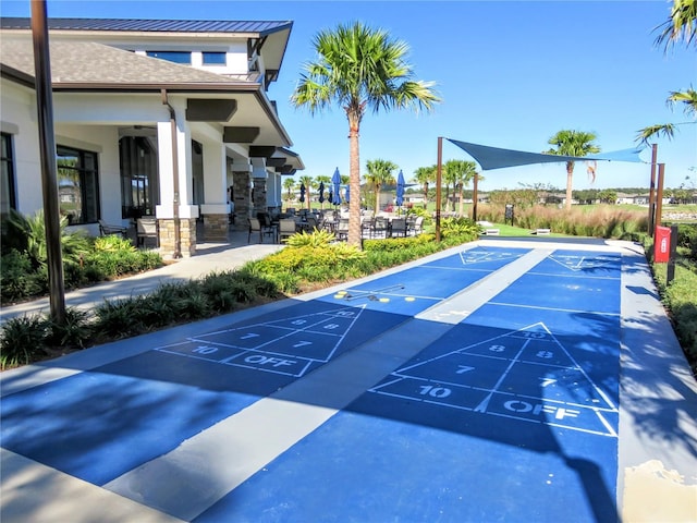 view of property's community with shuffleboard