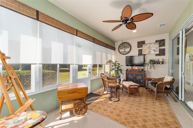 interior space featuring ceiling fan and visible vents