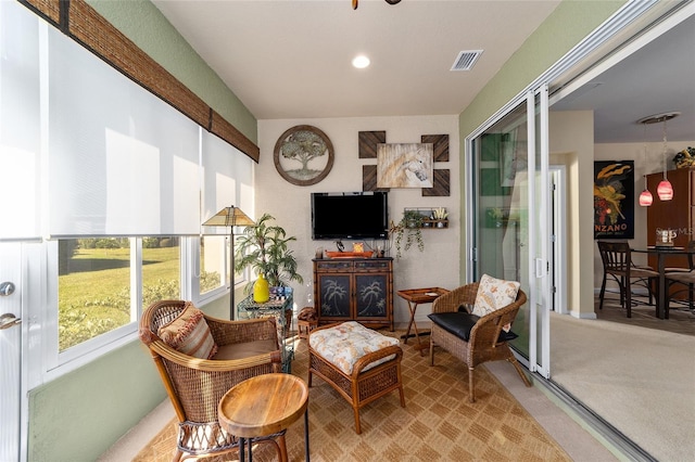 sitting room featuring carpet and visible vents