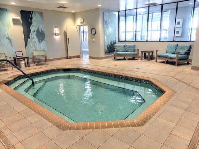 view of swimming pool with an indoor hot tub and a swimming pool