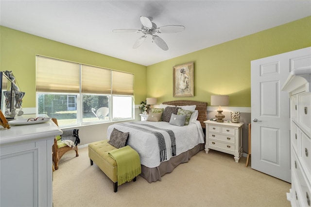 bedroom featuring ceiling fan and light colored carpet