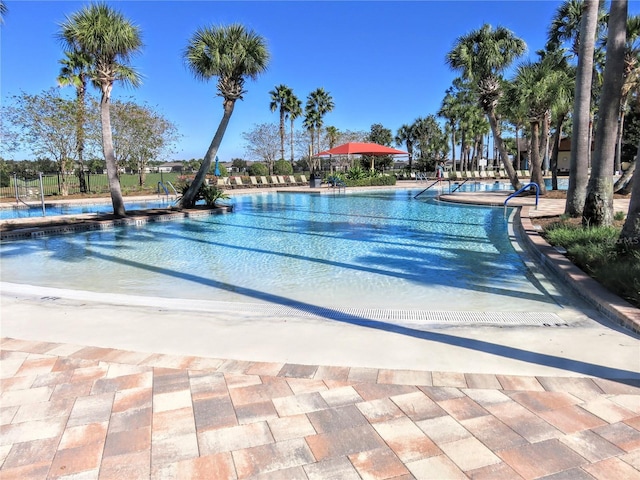 community pool featuring a patio area