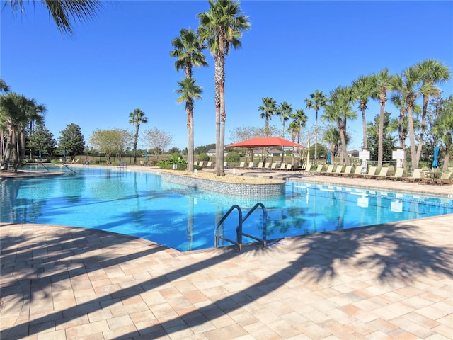 pool featuring a patio and a gazebo