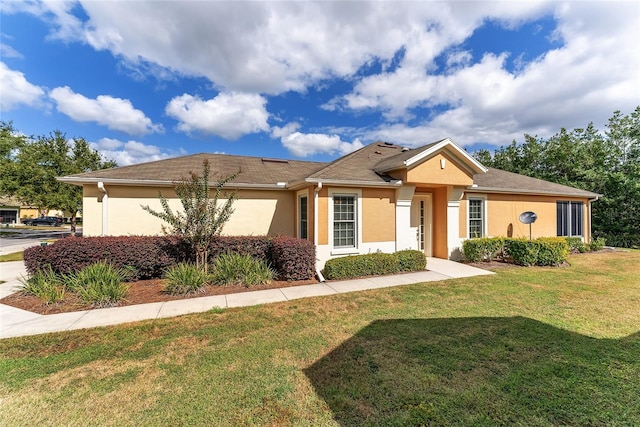 ranch-style home with a front yard