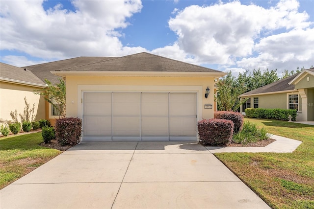 view of front of property with a garage and a front yard