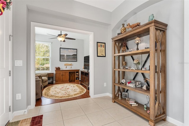 interior space with light wood-type flooring and ceiling fan