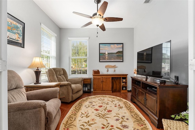 interior space featuring ceiling fan and dark wood-type flooring