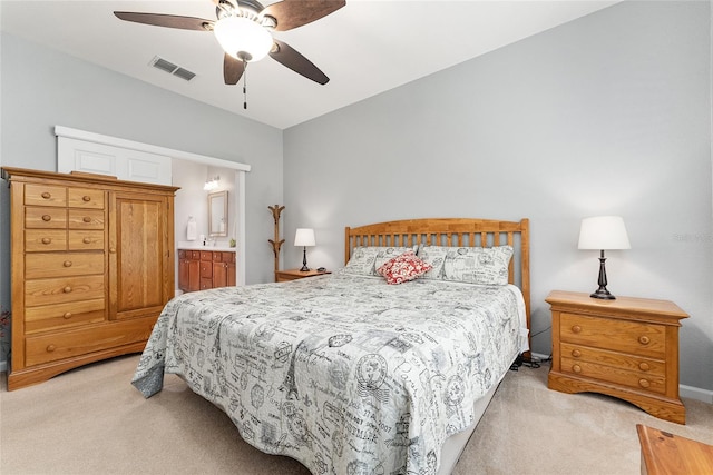 carpeted bedroom featuring ensuite bathroom, ceiling fan, and lofted ceiling