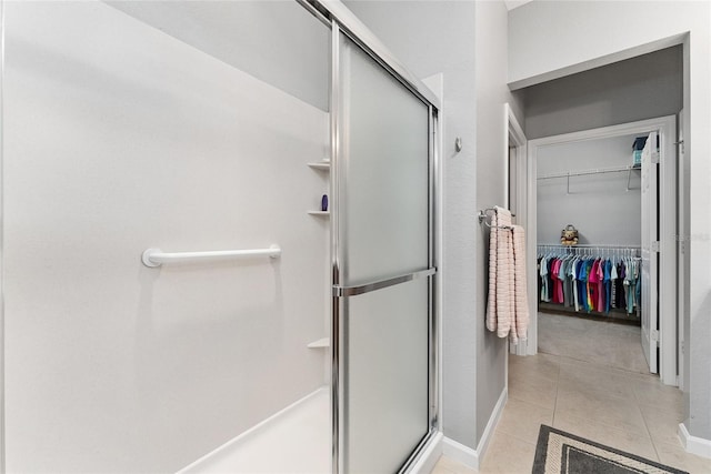 bathroom with tile patterned flooring and an enclosed shower