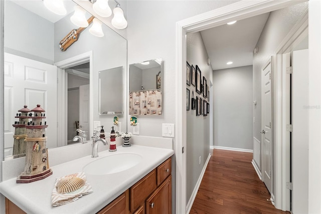 bathroom featuring wood-type flooring and vanity