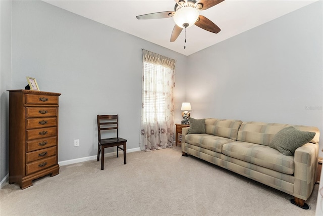 living room featuring ceiling fan and light colored carpet