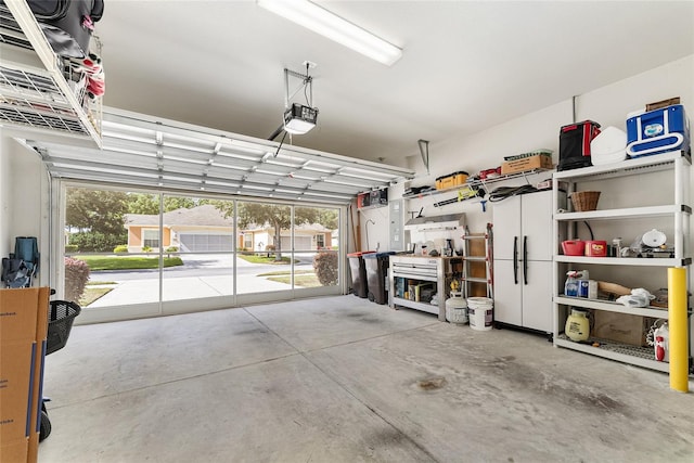 garage featuring a workshop area and a garage door opener