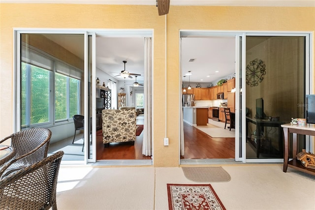 doorway to property with a patio area