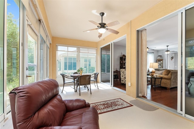 sunroom / solarium with ceiling fan