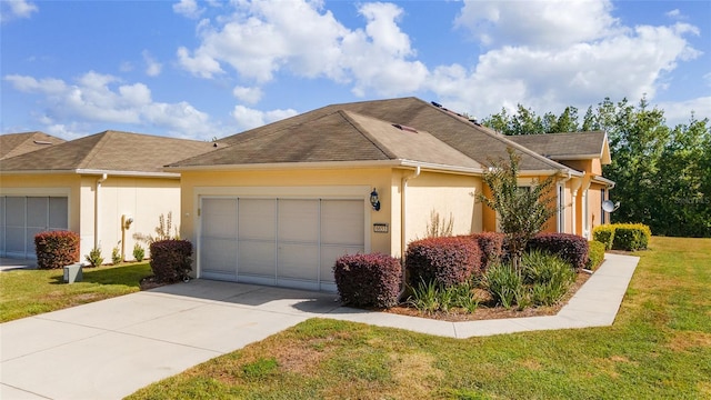 view of front facade with a front lawn and a garage