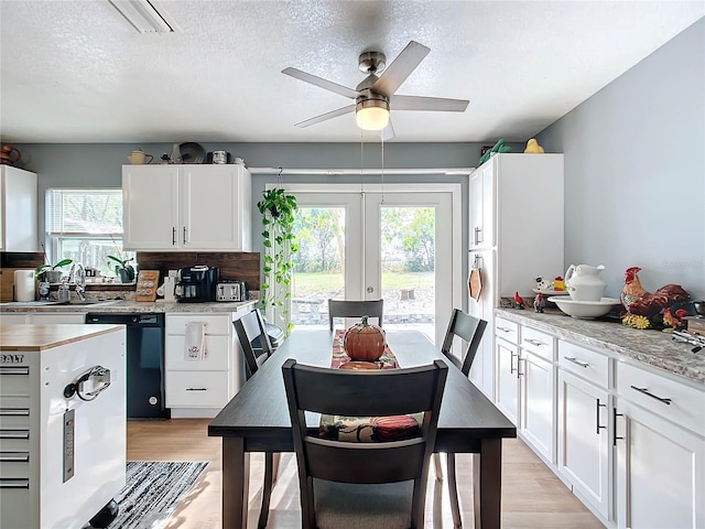 kitchen featuring white cabinetry, black dishwasher, and french doors