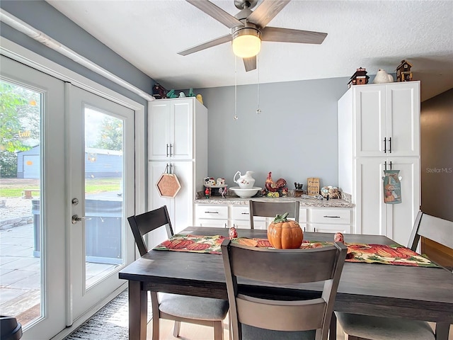 dining space featuring french doors, ceiling fan, and a healthy amount of sunlight