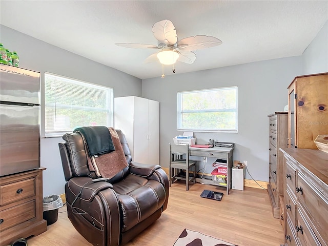 home office featuring ceiling fan and light wood-type flooring