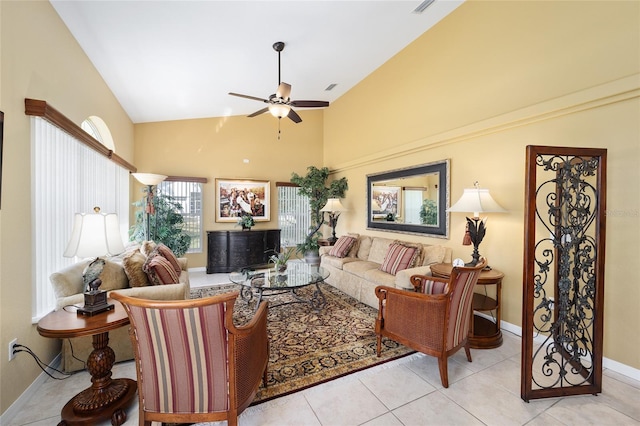 tiled living room featuring ceiling fan, high vaulted ceiling, visible vents, and baseboards