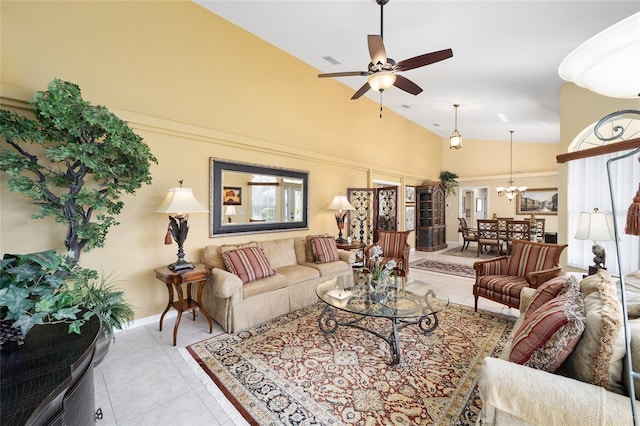 living area with visible vents, ceiling fan with notable chandelier, high vaulted ceiling, and light tile patterned flooring