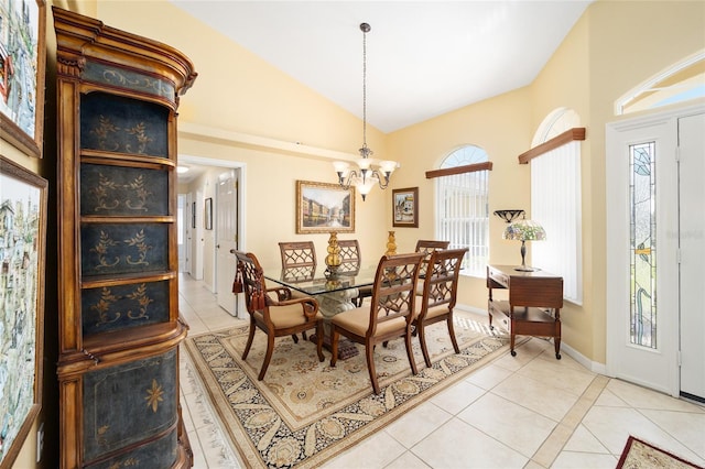 dining area with a healthy amount of sunlight, light tile patterned floors, and a chandelier